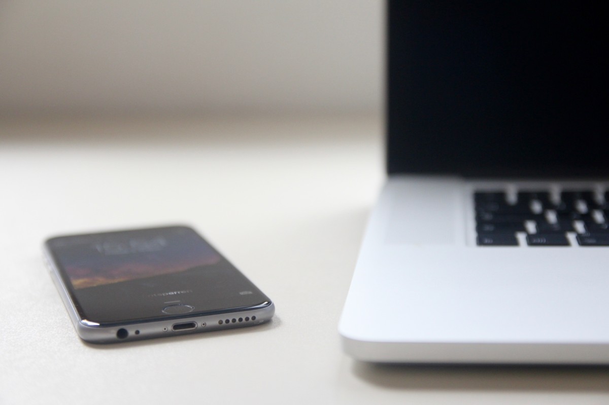A laptop and phone on a clean desk